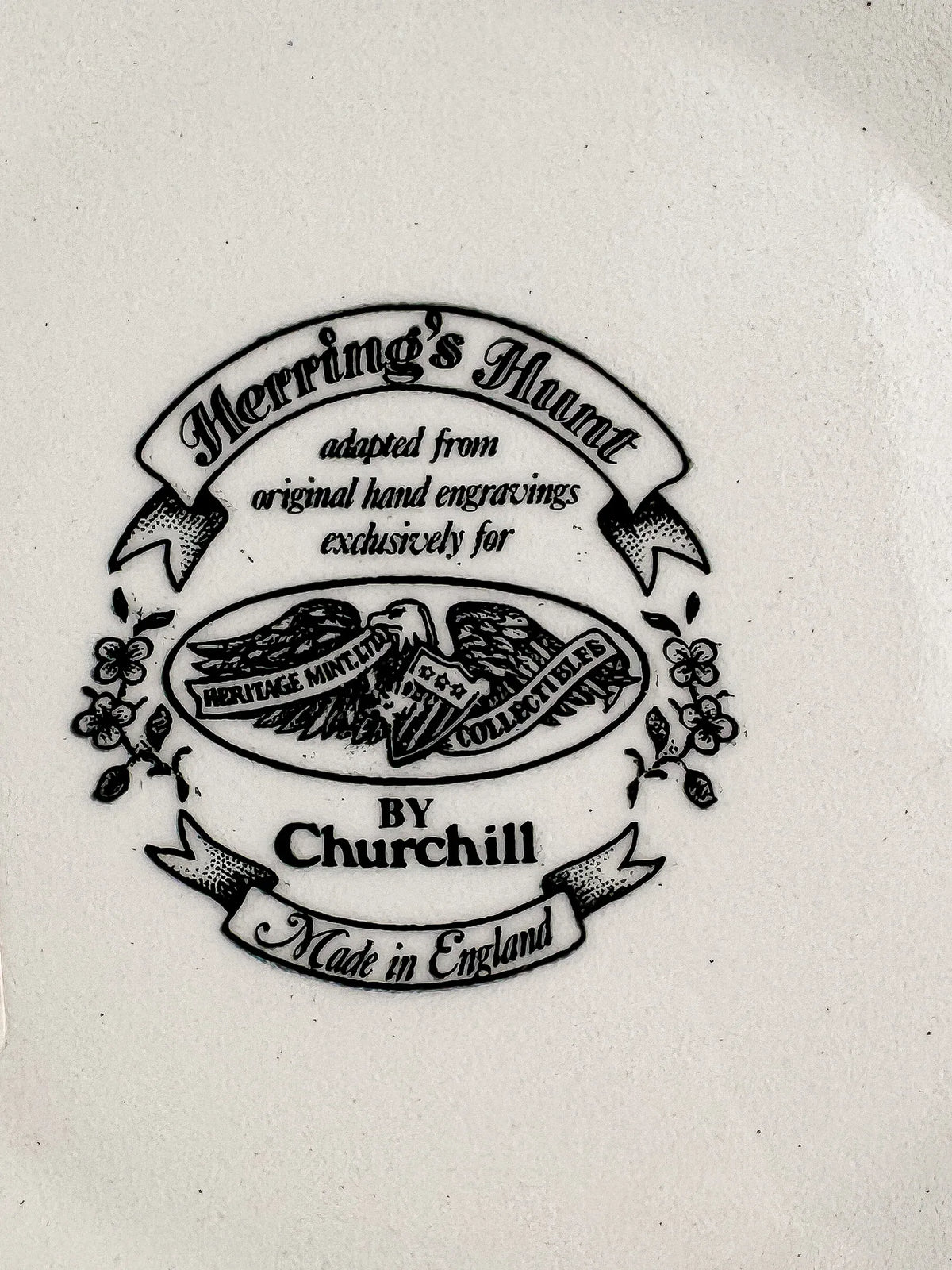 Close-up of the Churchill backstamp: Herring’s Hunt adapted from original hand engravings exclusively for Heritage Mint Ltd Collectibles, by Churchill, Made in England, with an eagle motif and floral sprays.