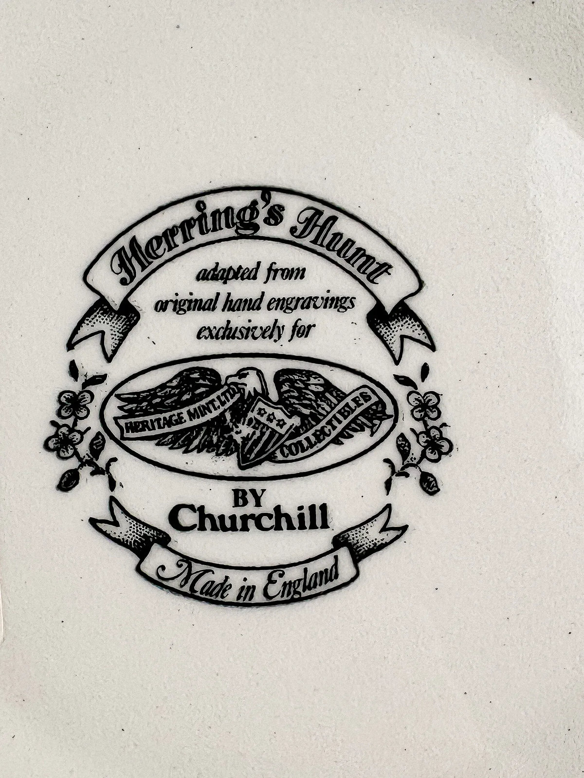 Close-up of the Churchill backstamp: Herring’s Hunt adapted from original hand engravings exclusively for Heritage Mint Ltd Collectibles, by Churchill, Made in England, with an eagle motif and floral sprays.