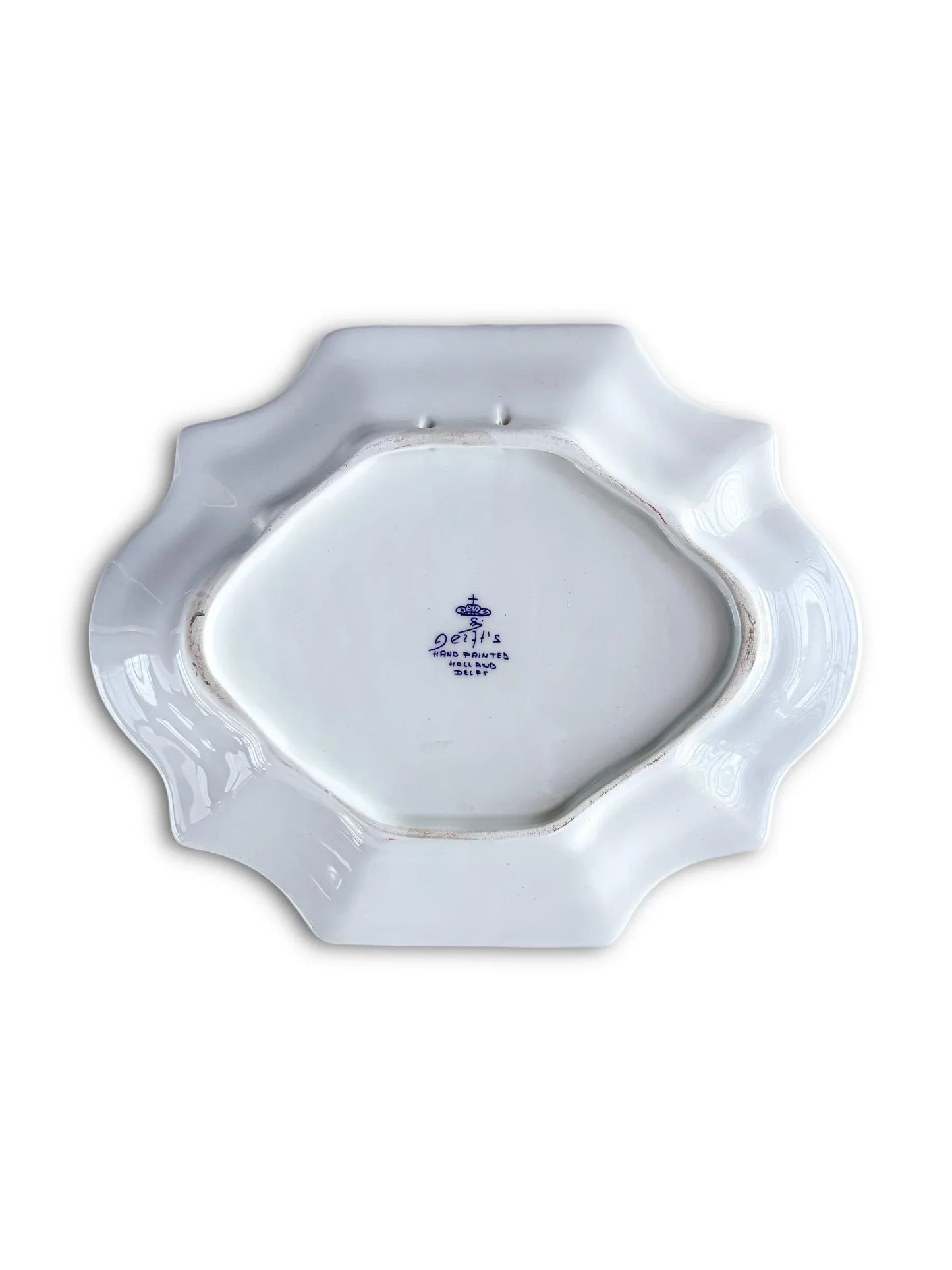 Vintage white ceramic platter with scalloped edges and blue Delft stamp on bottom