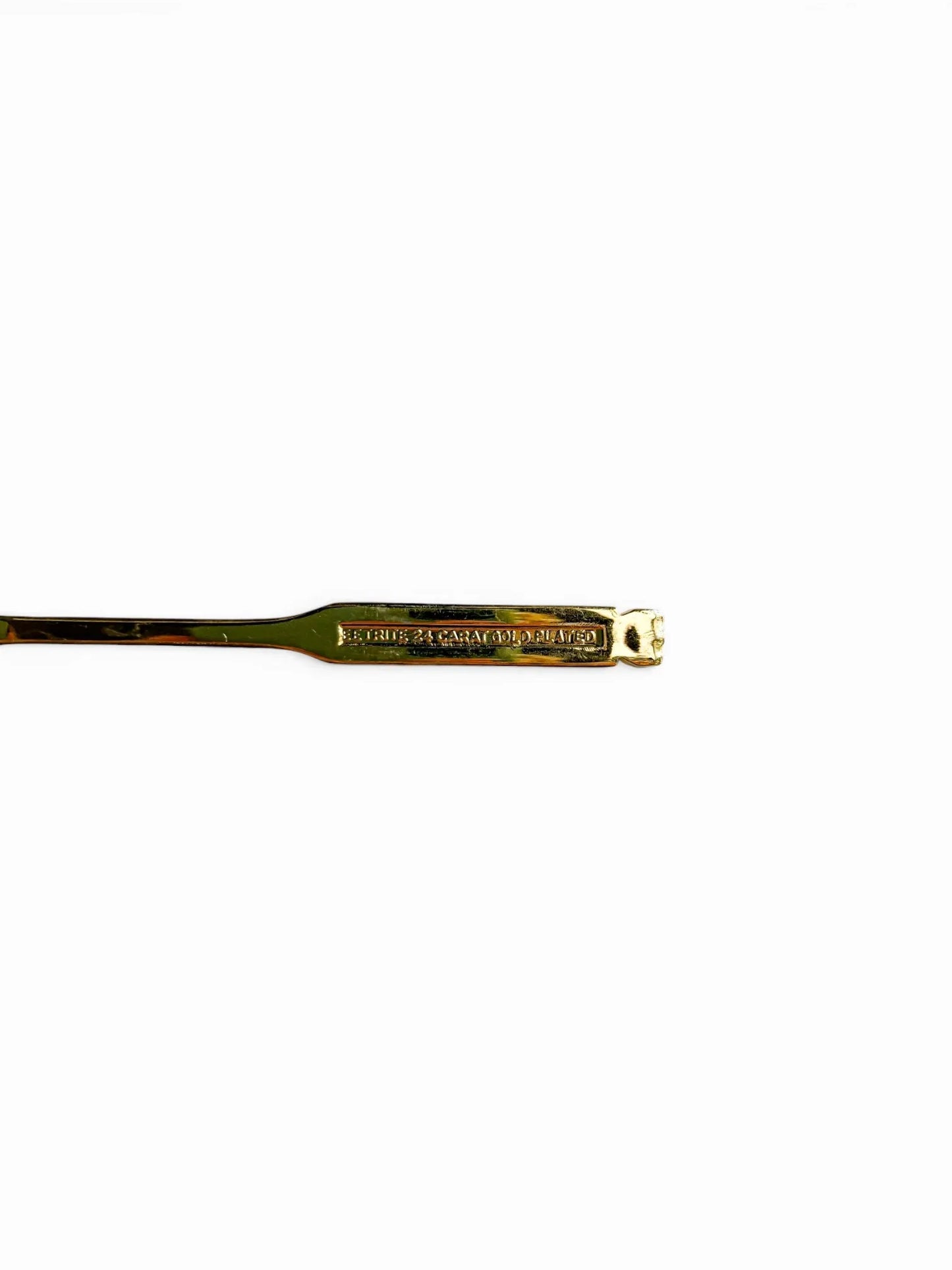 Close-up of the reverse side of an Eetrite teaspoon handle, showing the authentic hallmark stamp that reads "Eetrite 24 Carat Gold Plated.
