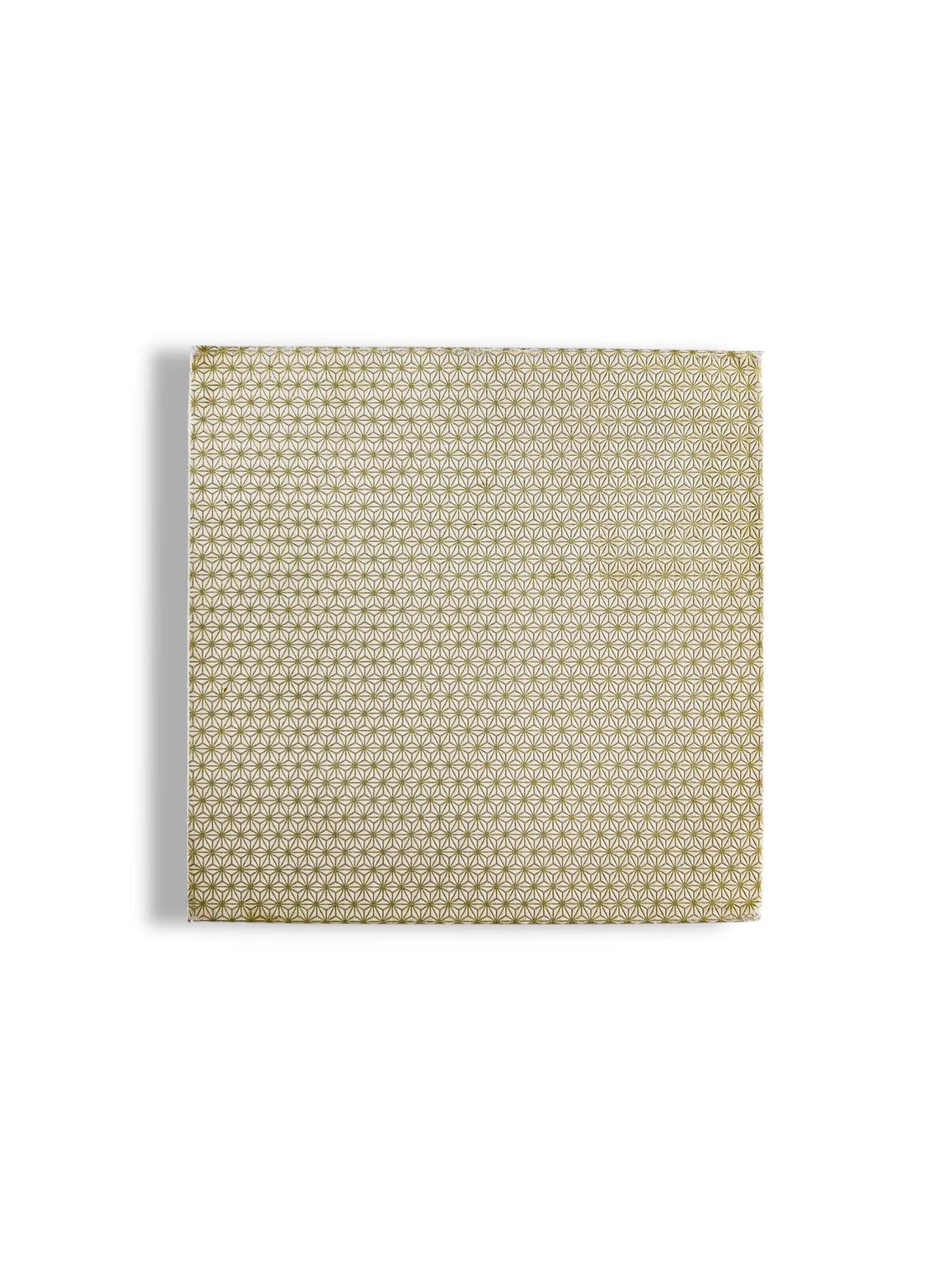 Square wrapped gift box with gold geometric floral pattern on white background