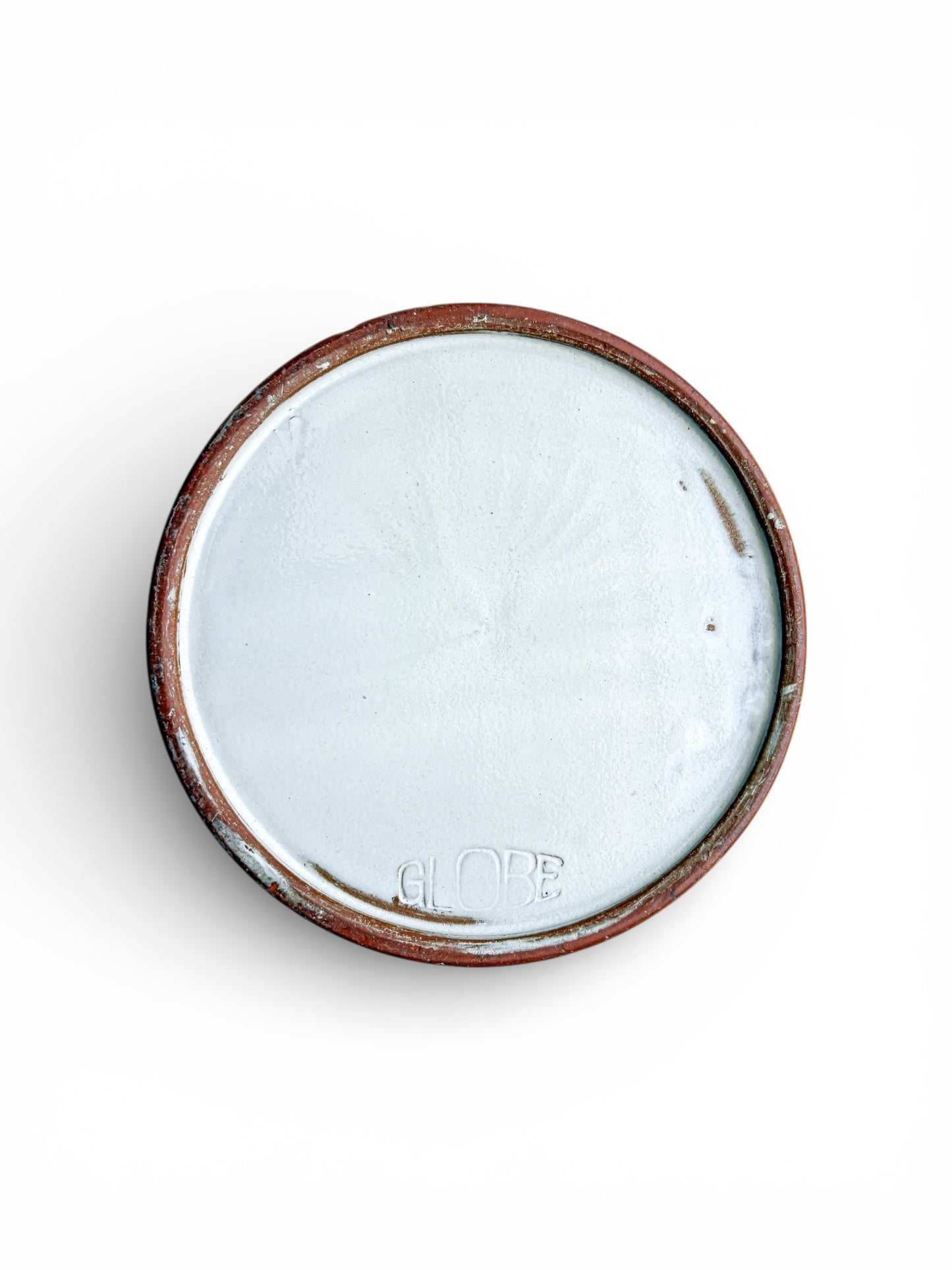 Bottom of vintage ceramic bowl with white glaze and embossed GLOBE mark