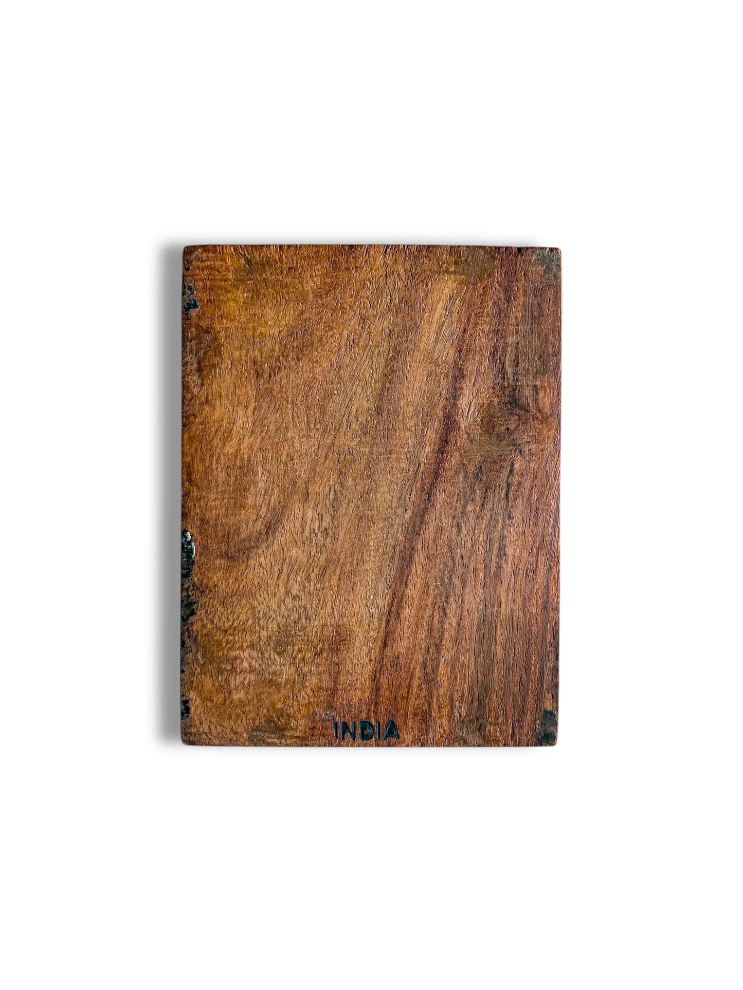 Rectangular wooden board with natural grain texture and 'INDIA' stamped on bottom edge