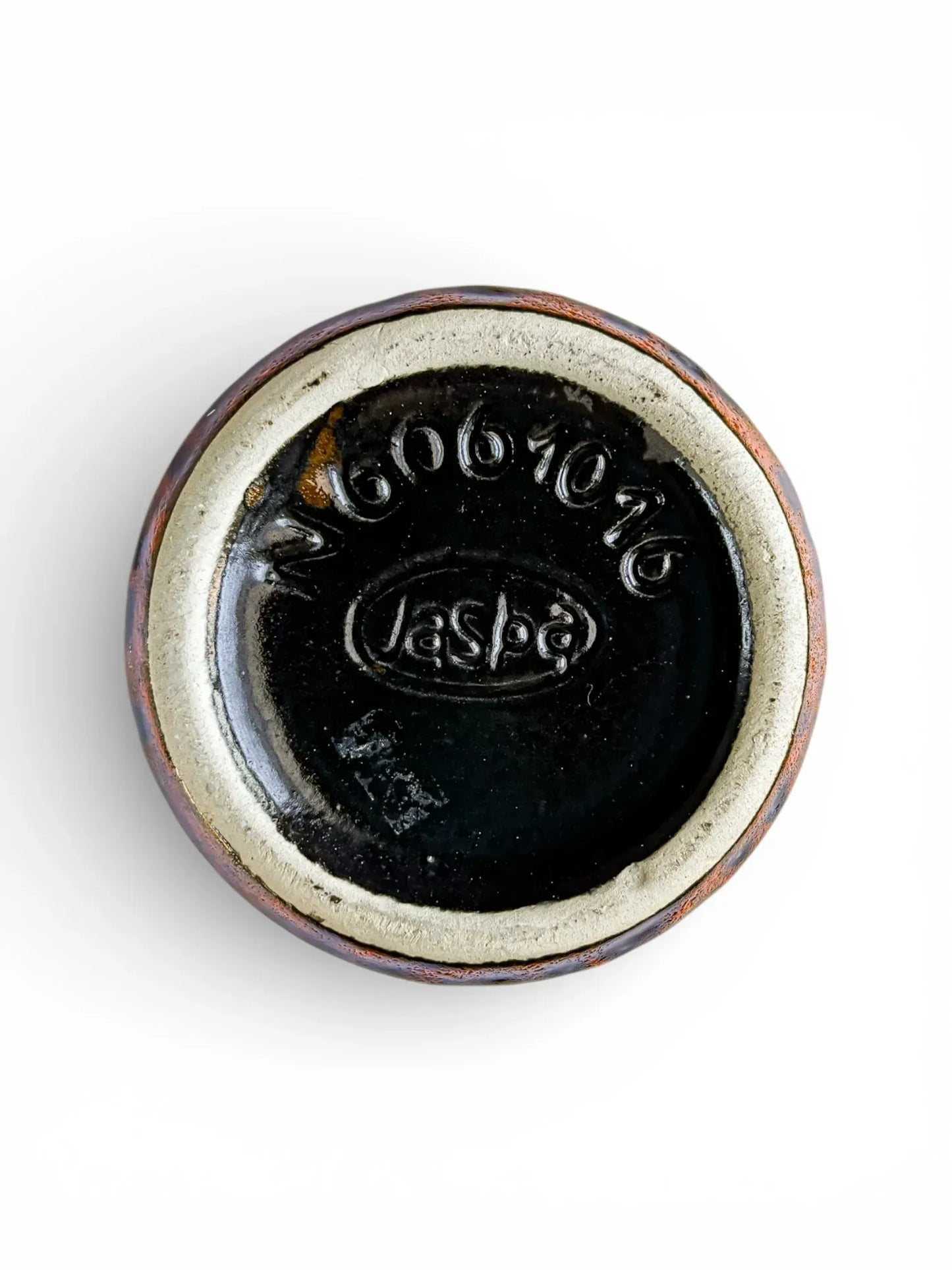 Base of Jasba Keramik vase showing oval Jasba stamp and model number N 606 10 16 on black glaze