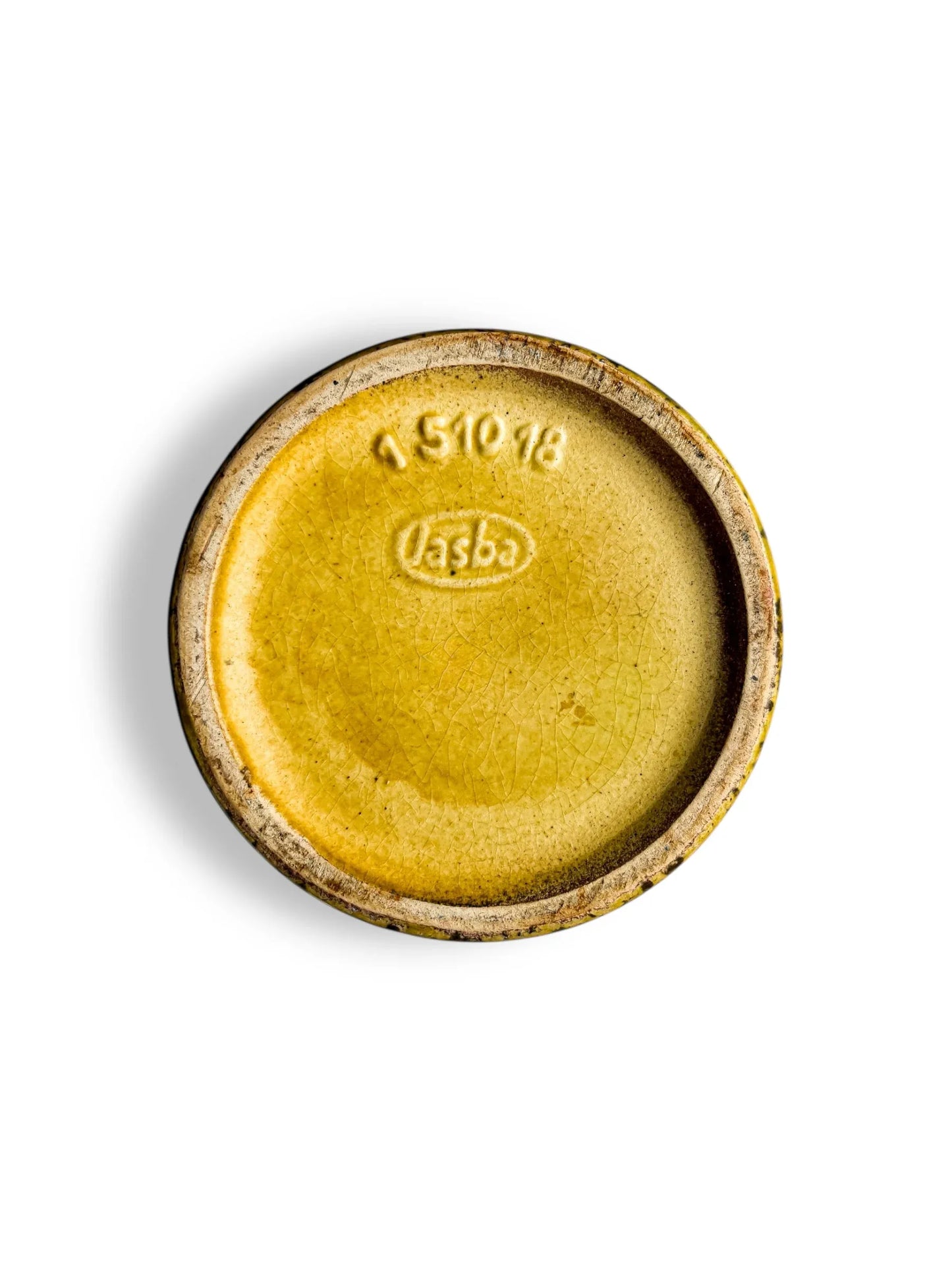 Bottom of a vintage yellow glazed ceramic pot with embossed 'lasba' logo and number 151018