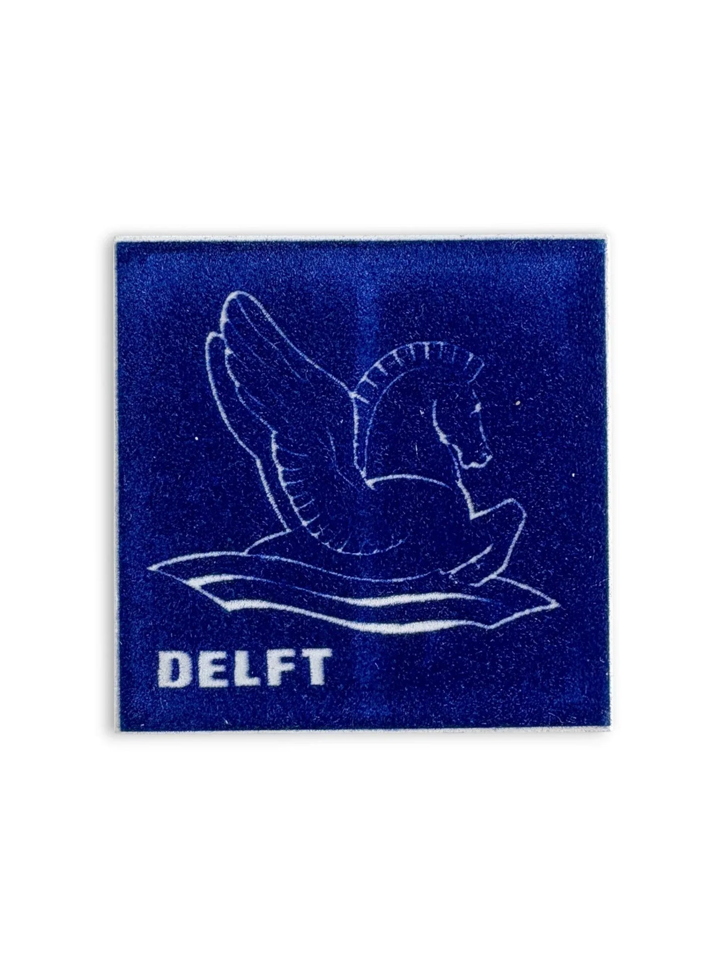Close-up detail of a Regina Delft tile showing the protective felt-lined backing, designed to protect surfaces when used as a decorative coaster.