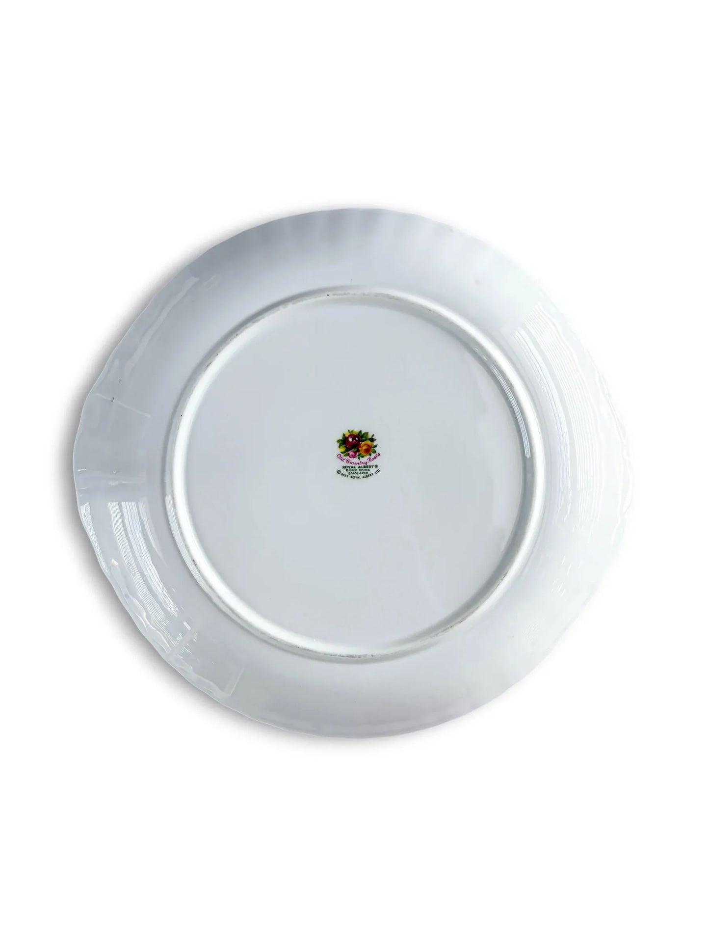 Underside view of the Royal Albert Old Country Roses cake plate base, displaying the authentic English vintage crest and backstamp confirming first-quality manufacture.