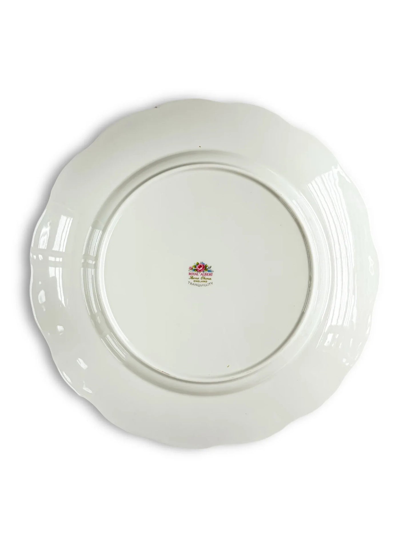 Back of a vintage Royal Albert porcelain plate with floral mark and scalloped edge