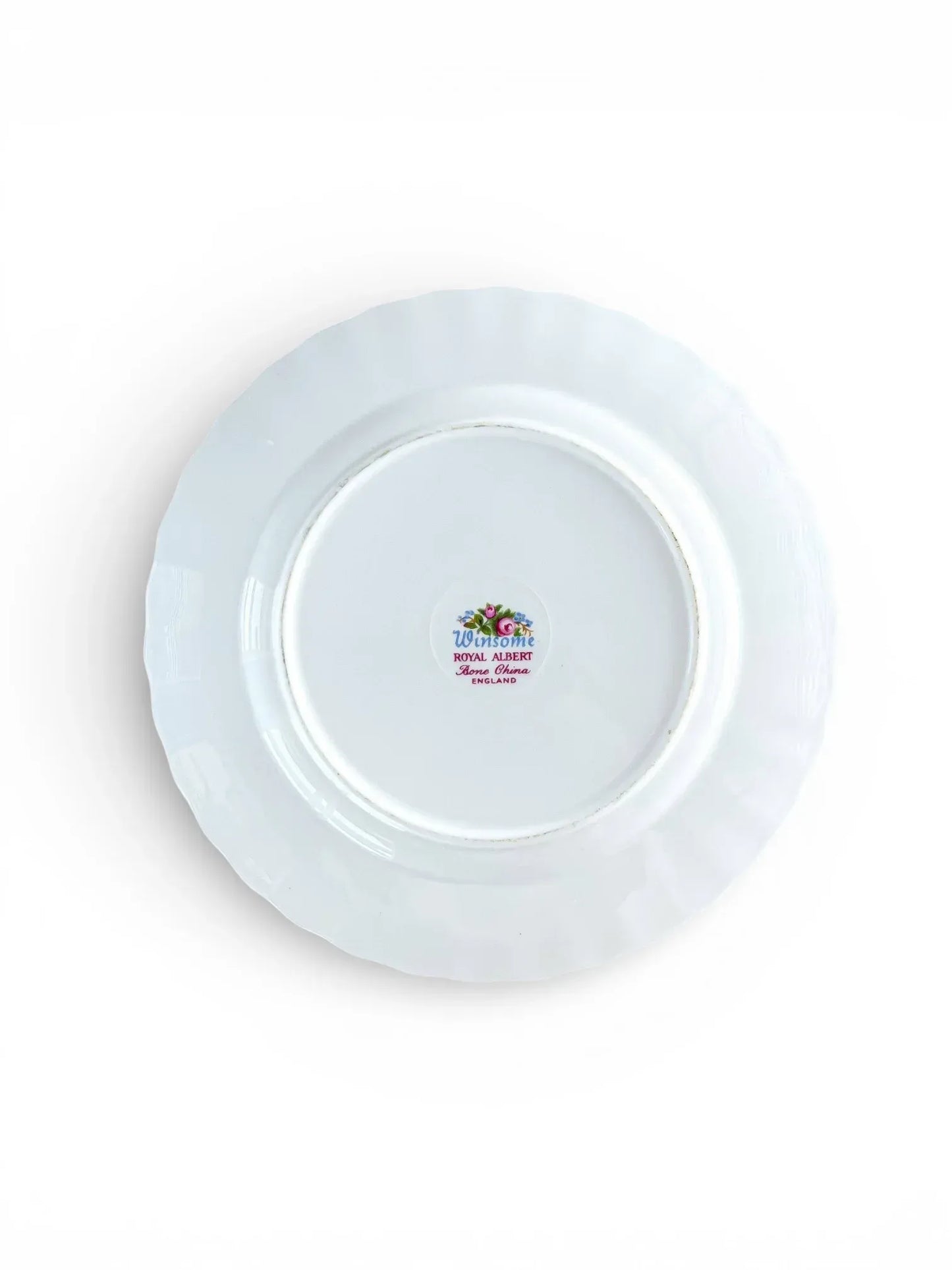 The underside of a Royal Albert Winsome plate showing the authentic "Winsome Royal Albert Bone China England" backstamp with the crown emblem and blue script.
