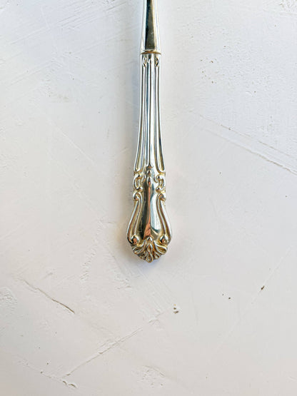 Elegant Silver-Plated Serving Fork with Ornate Handle Design