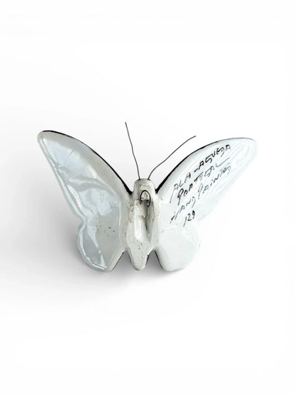 Porcelain butterfly figurine with handwritten text, vintage ceramic collectible