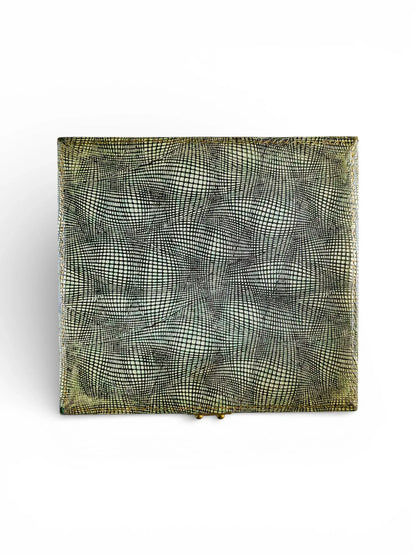 Vintage rectangular silver case with textured, geometric patterned surface on white background