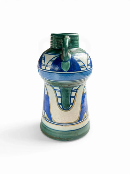 Side profile of a 20cm Gouda PZH Damascus vase highlighting the architectural dual-handle design and the continuous hand-painted Iznik-inspired pattern in deep blue and green.