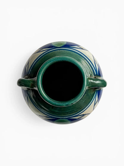 Top-down view of an Art Nouveau Gouda vase showing the flared green rim and symmetrical circular form, emphasizing the clean lines and well-preserved high-glaze finish.
