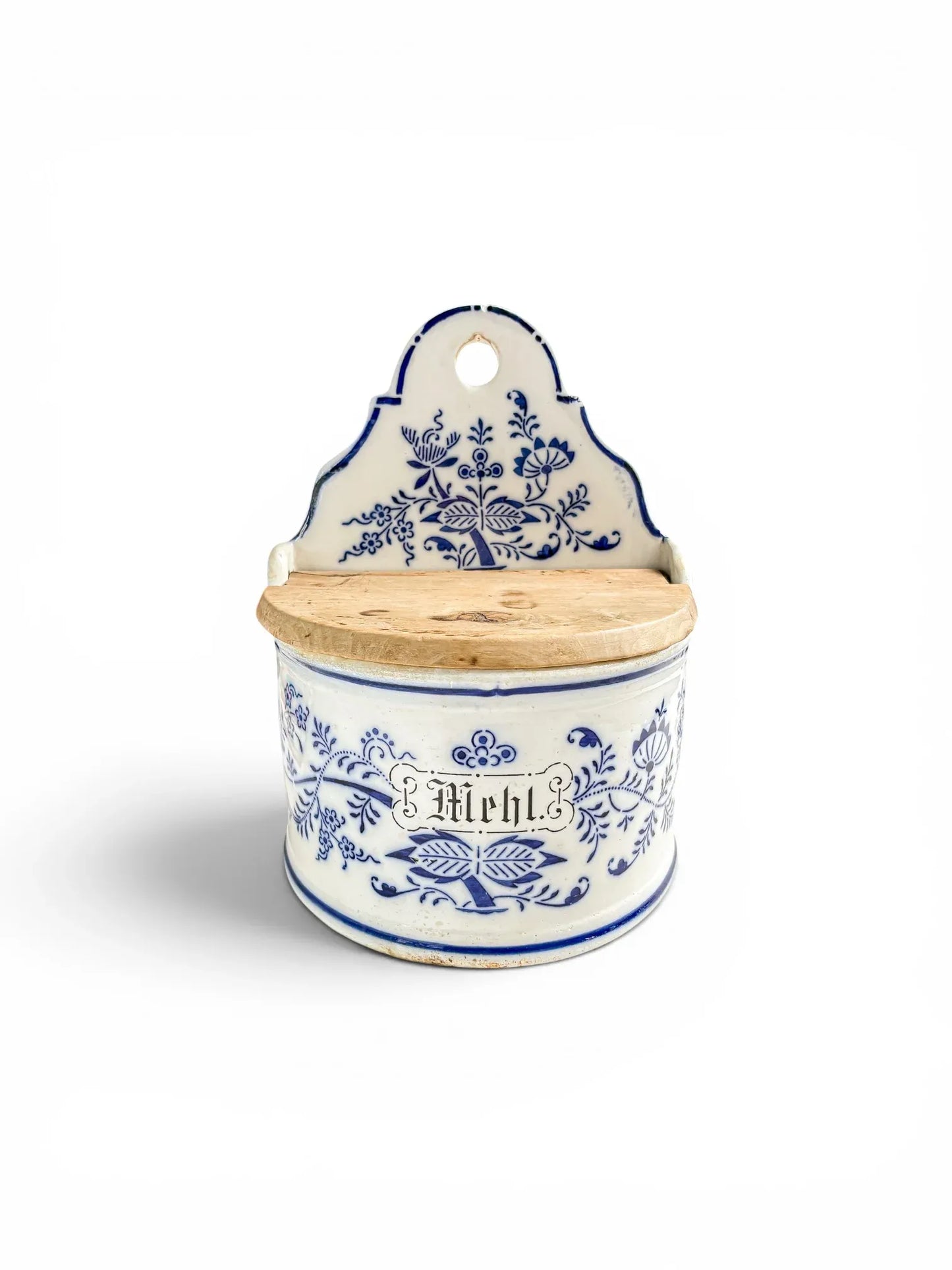 Antique German blue and white stoneware Mehl (flour) kitchen storage box with high scrolled backplate and original hinged wooden lid, isolated on a white background.