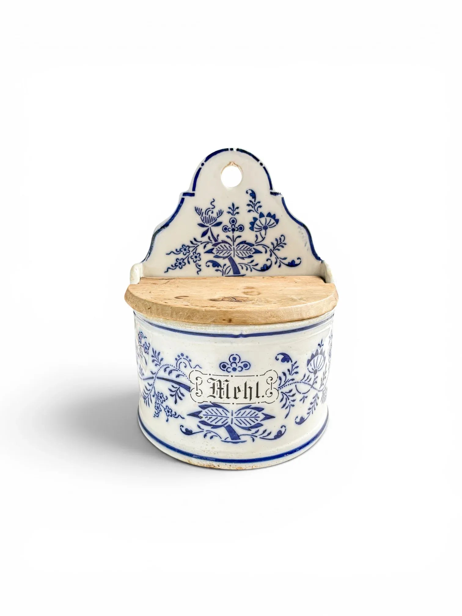 Antique German blue and white stoneware Mehl (flour) kitchen storage box with high scrolled backplate and original hinged wooden lid, isolated on a white background.