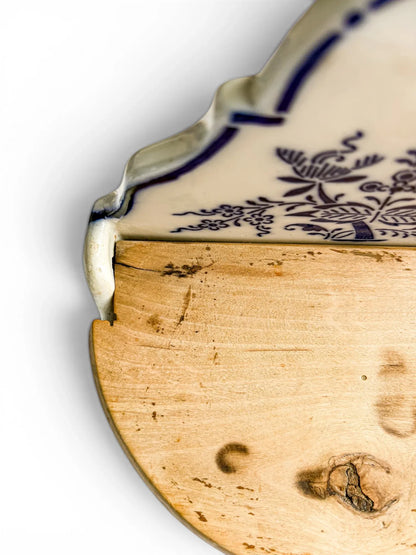 Close-up detail of the left wooden hinge area, showing the rustic wood grain, a minor stable hairline split near the pin, and the original hand-fitted hinge assembly.