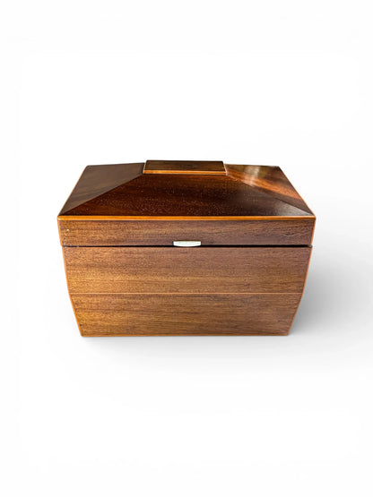 Vintage geometric wooden box with lid, collectible home decor against a white background