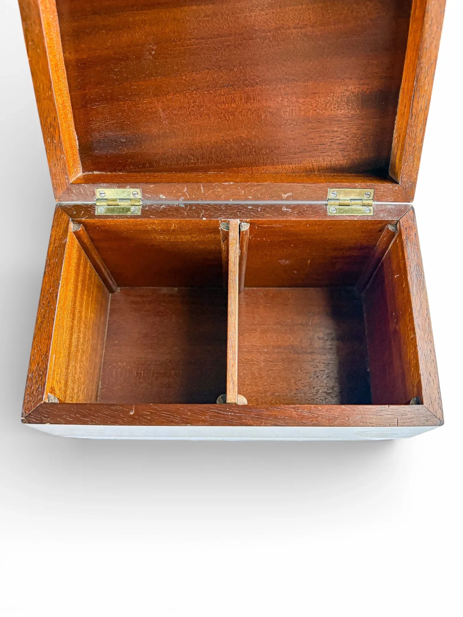 Vintage wooden tea caddy with open lid and two compartments on white background