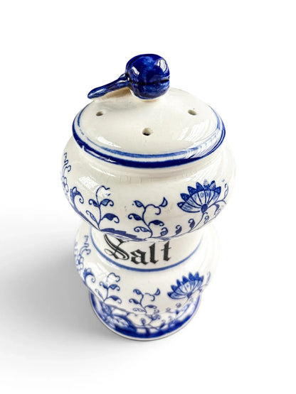 Top view of an Arnart Blue Onion salt shaker lid with pierced holes and modelled fruit finial