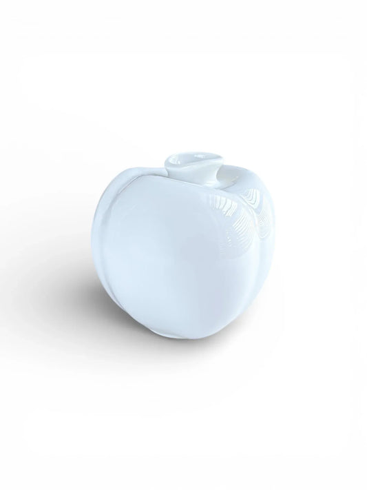 Minimalist white porcelain Arzberg Peach bud vase showing organic vertical ridges and asymmetrical rim against a white background.