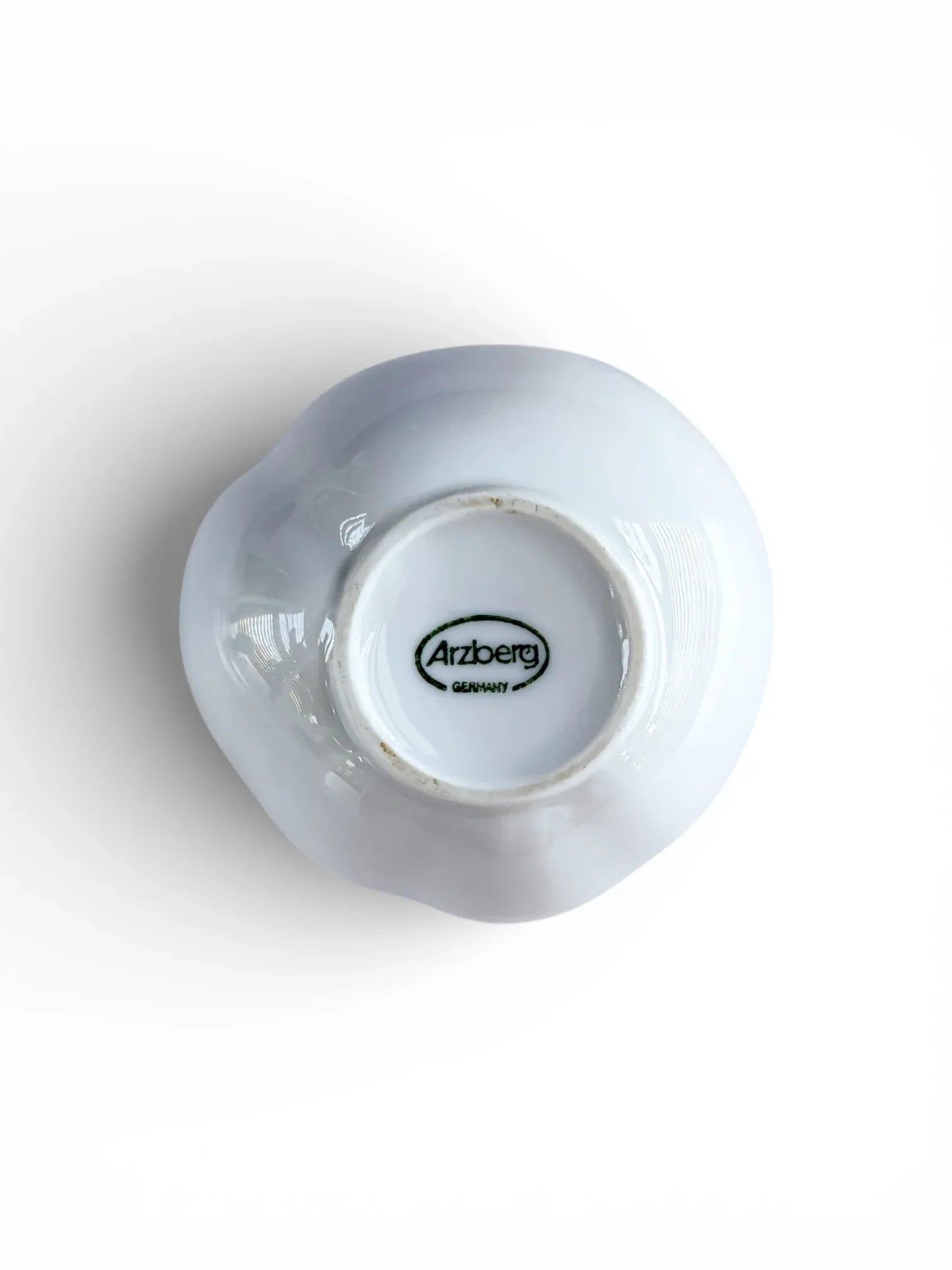 Underside of Arzberg porcelain vase featuring the authentic green oval "Arzberg Germany" manufacturer's stamp and unglazed foot ring.