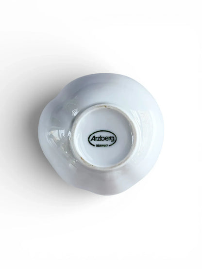 Underside of Arzberg porcelain vase featuring the authentic green oval "Arzberg Germany" manufacturer's stamp and unglazed foot ring.