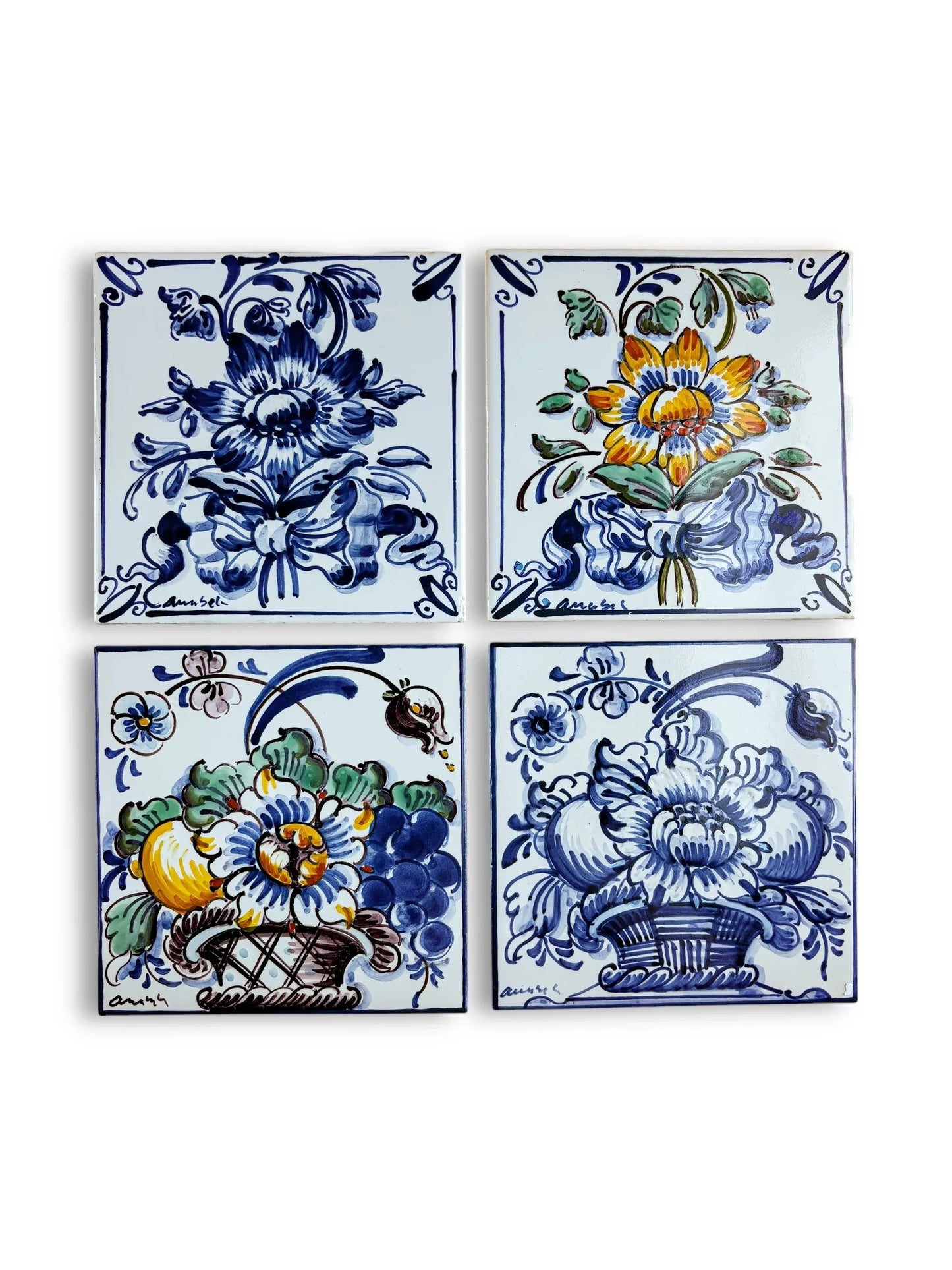 Curated set of 4 Portuguese Azulejos tiles featuring floral bouquets in blue, yellow, and green.