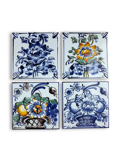 Curated set of 4 Portuguese Azulejos tiles featuring floral bouquets in blue, yellow, and green.