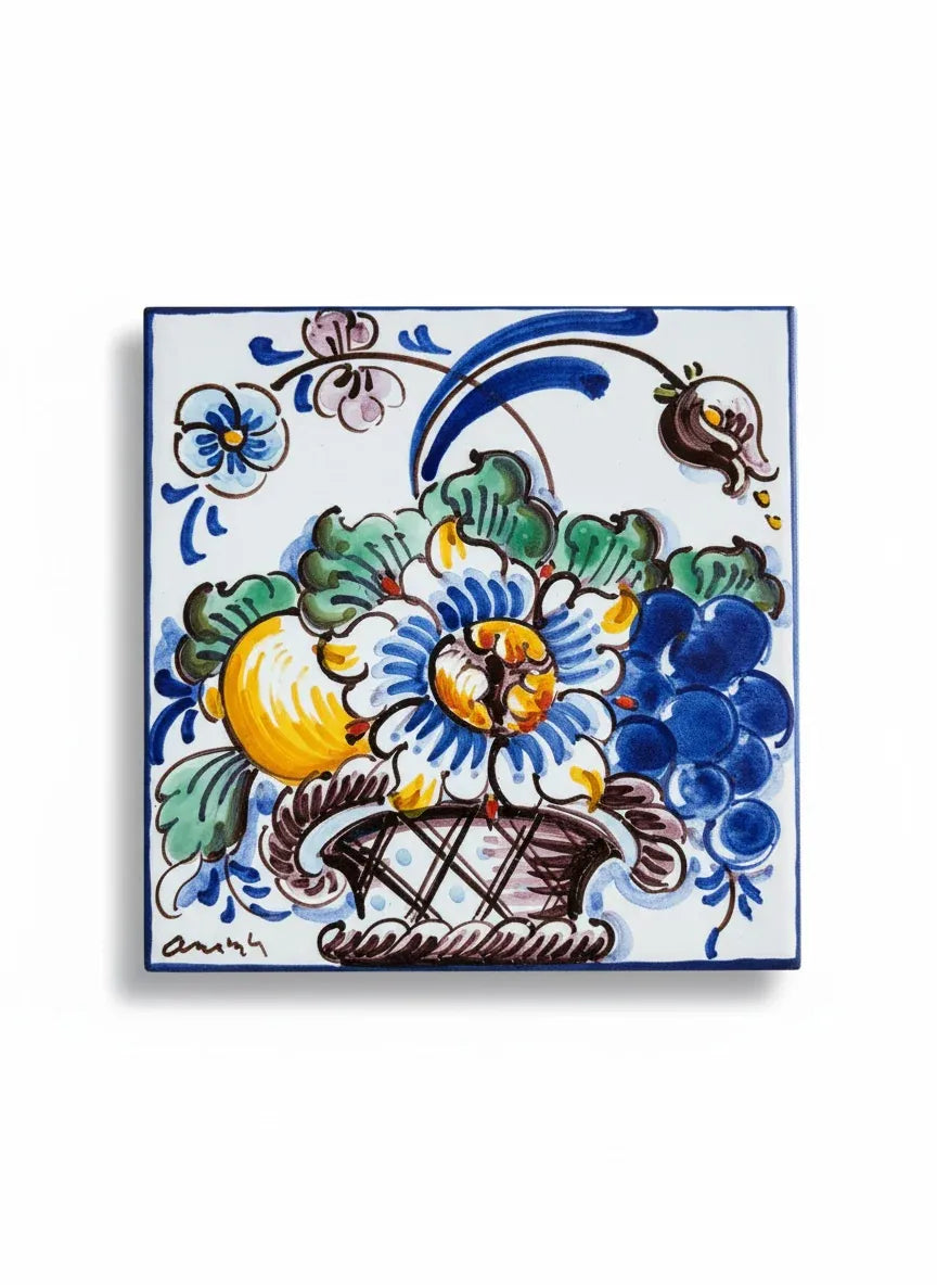 Hand-painted Portuguese tile showing a vibrant floral basket with blue, yellow, and green pigments.