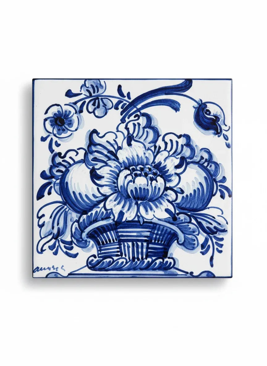 Vintage blue and white ceramic tile featuring a detailed basket of flowers in the traditional Azulejo style.