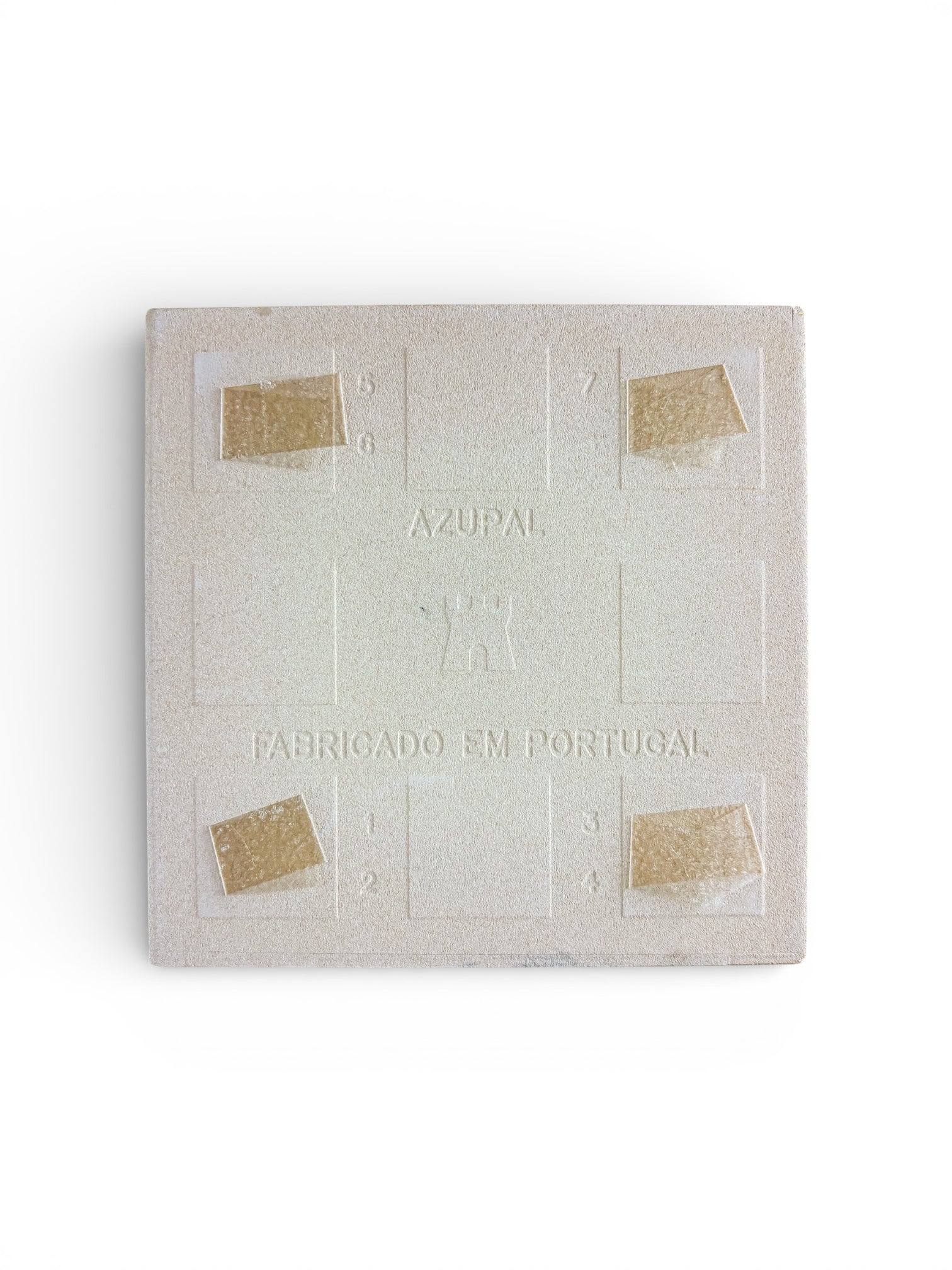 Underside of a vintage ceramic tile showing the authentic Azupal castle hallmark and Fabricado em Portugal stamp.
