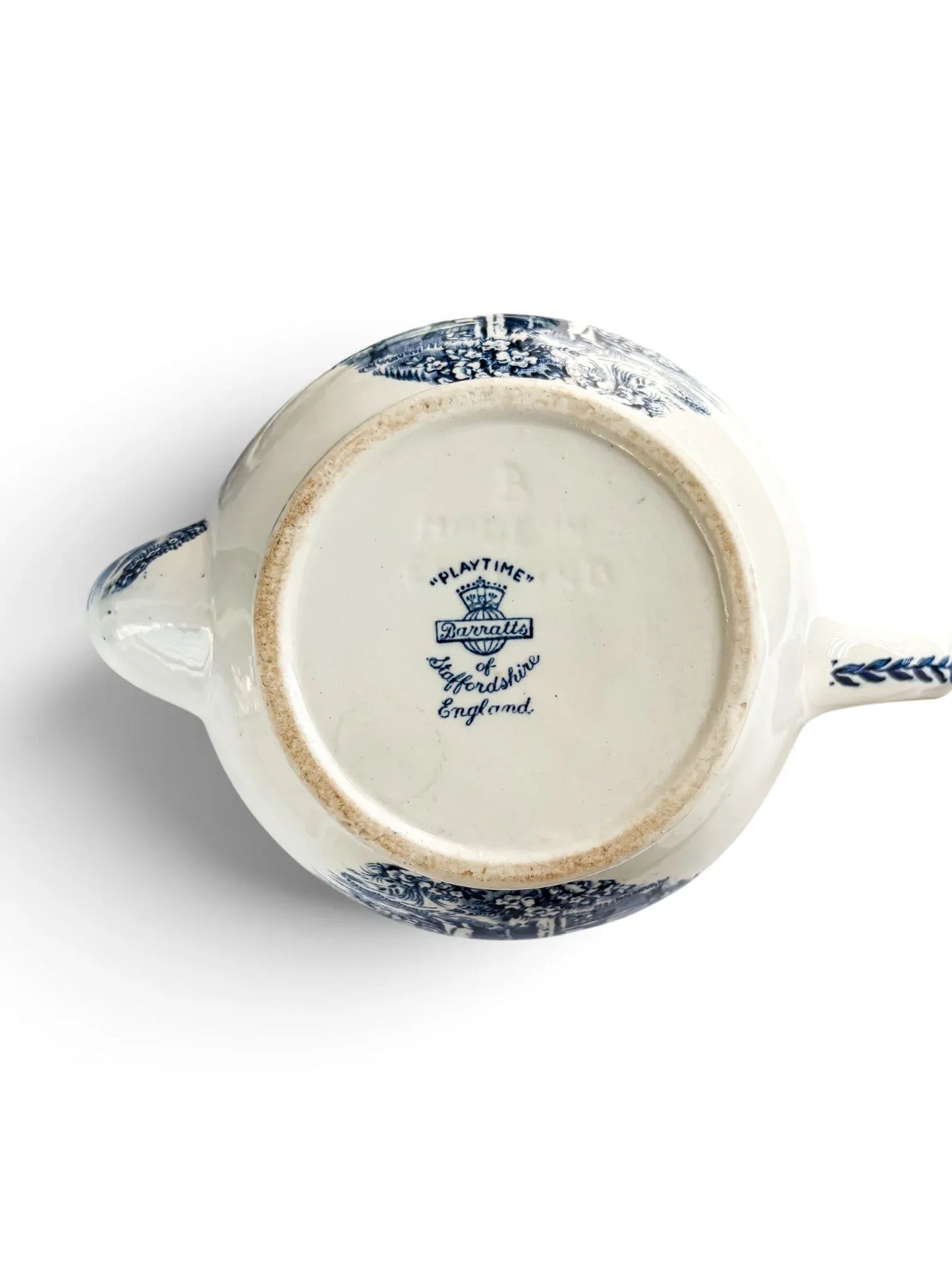 Base of the teapot with Barratts of Staffordshire England backstamp, crown mark and the pattern name Playtime.