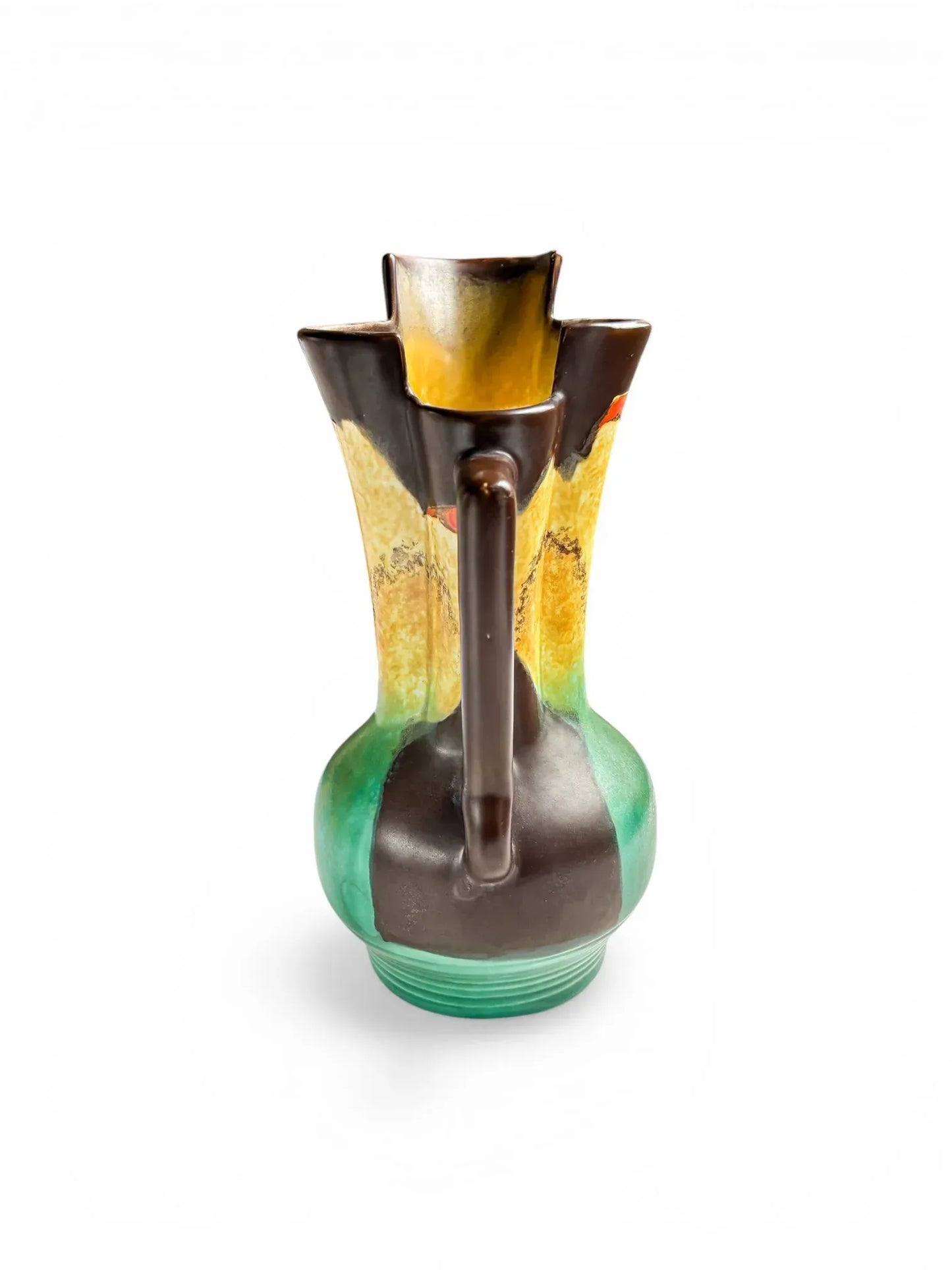 Rear view of an Art Deco Beswick jug highlighting the geometric chocolate brown handle and the interior glaze of the tiered skyscraper rim.