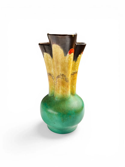 Front-facing view of a Beswick Shape 177/1 jug illustrating the symmetrical fluted neck and the hand-painted orange accents on a yellow ground.