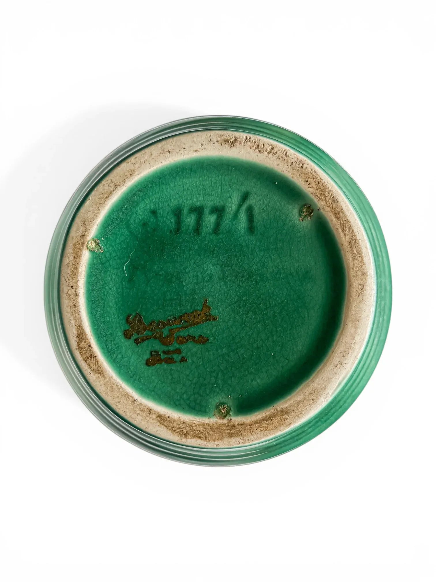 Underside of a Beswick jug showing the green glazed base, impressed shape number 177/1, and the gold Beswick Ware Made in England script backstamp.