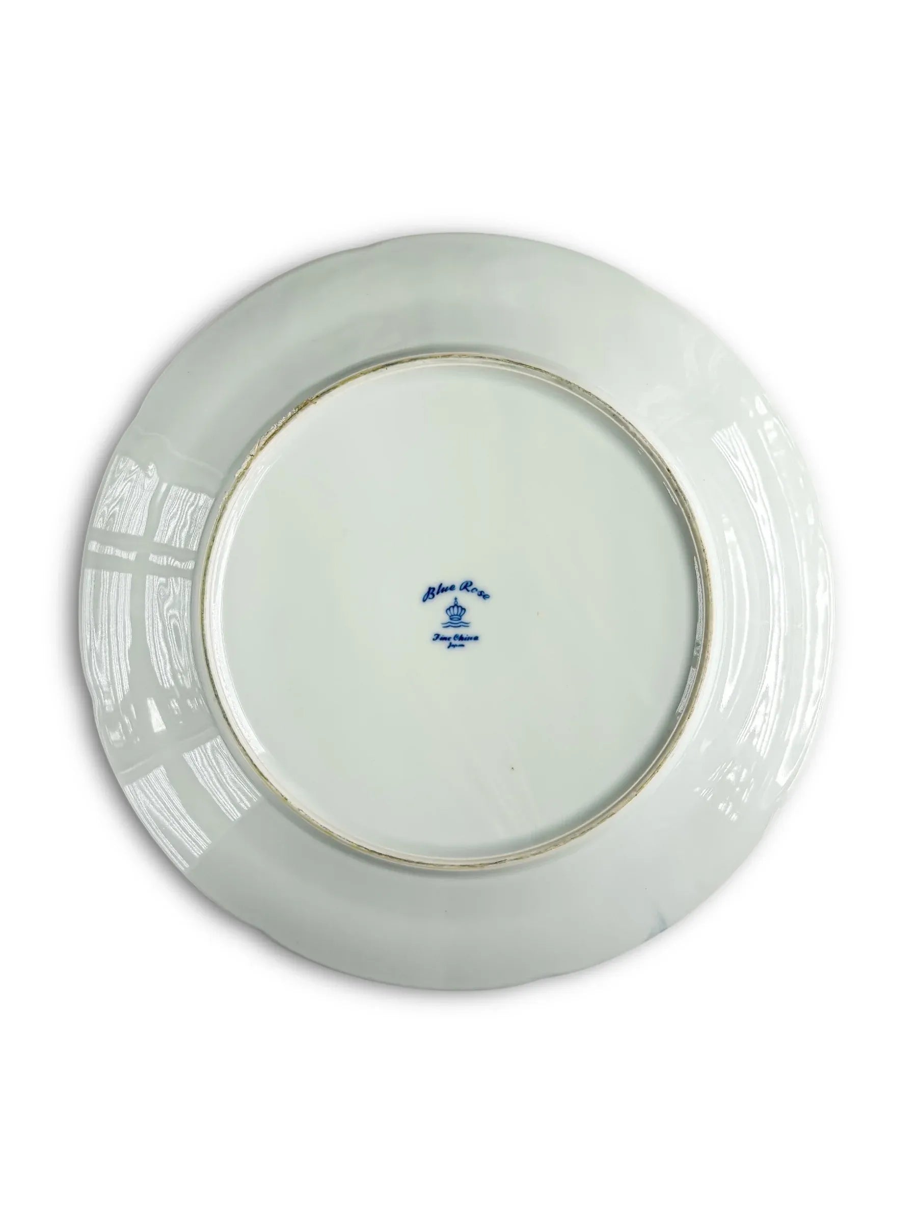 Back of white porcelain plate with blue maker's mark, Blue River Japan stamp visible