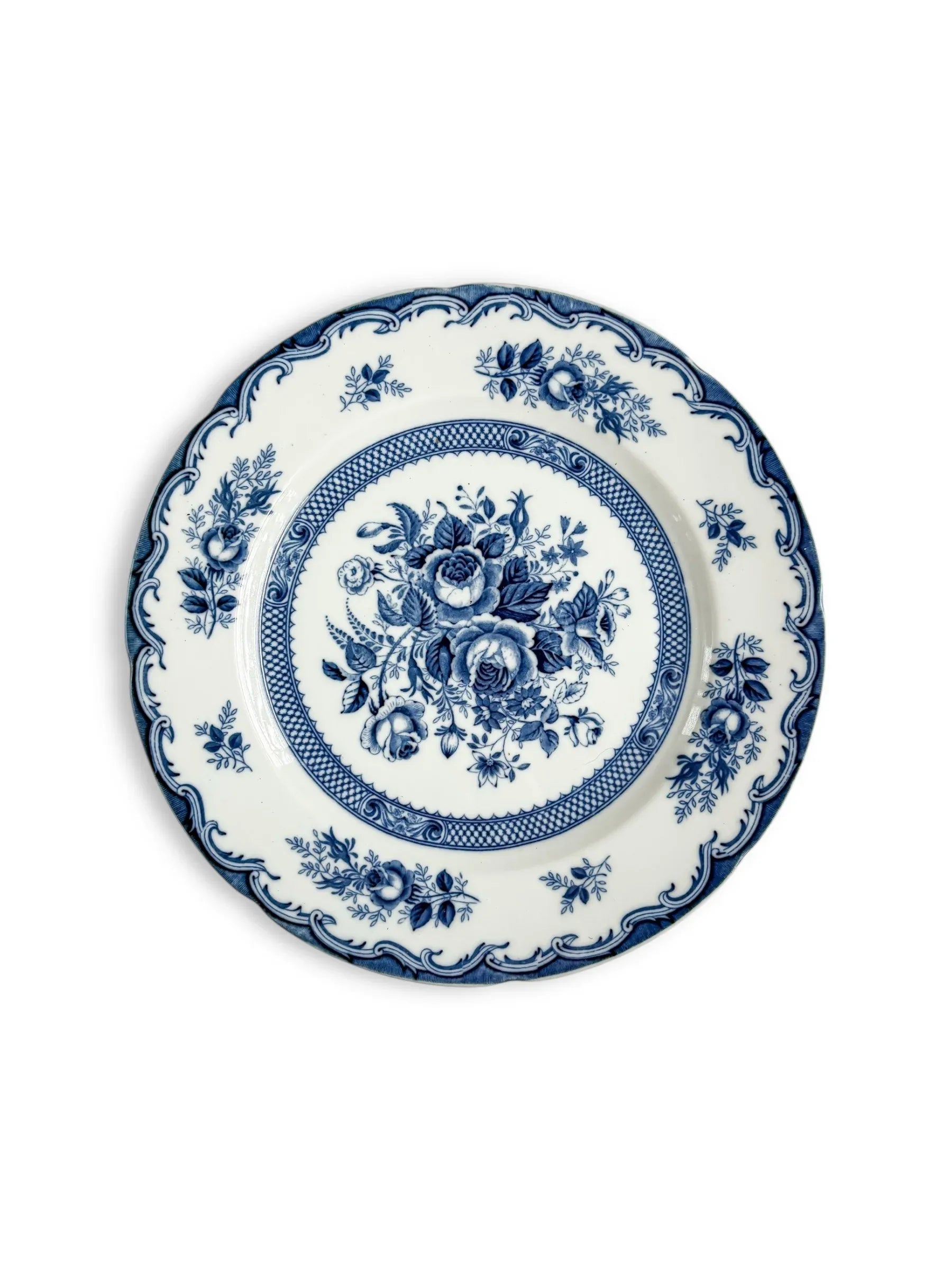 Blue and white porcelain plate with floral pattern and decorative edge
