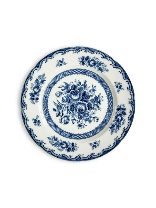 Blue and white porcelain plate with floral pattern and decorative edge