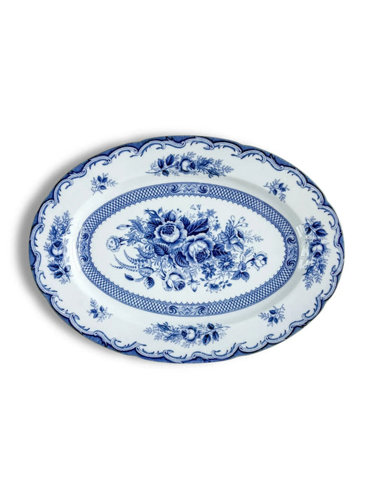 Blue and white oval porcelain platter with floral pattern and decorative border
