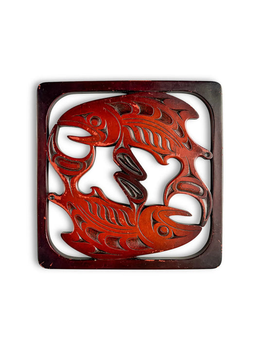 Vintage carved wood trivet with two stylized fish in a square frame, collectible tableware