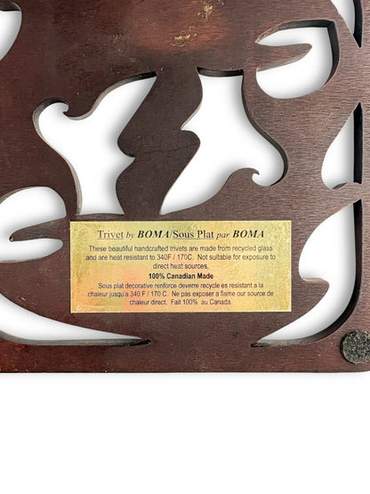 Handcrafted wooden trivet with cut-out leaf design and gold product label, vintage tableware.