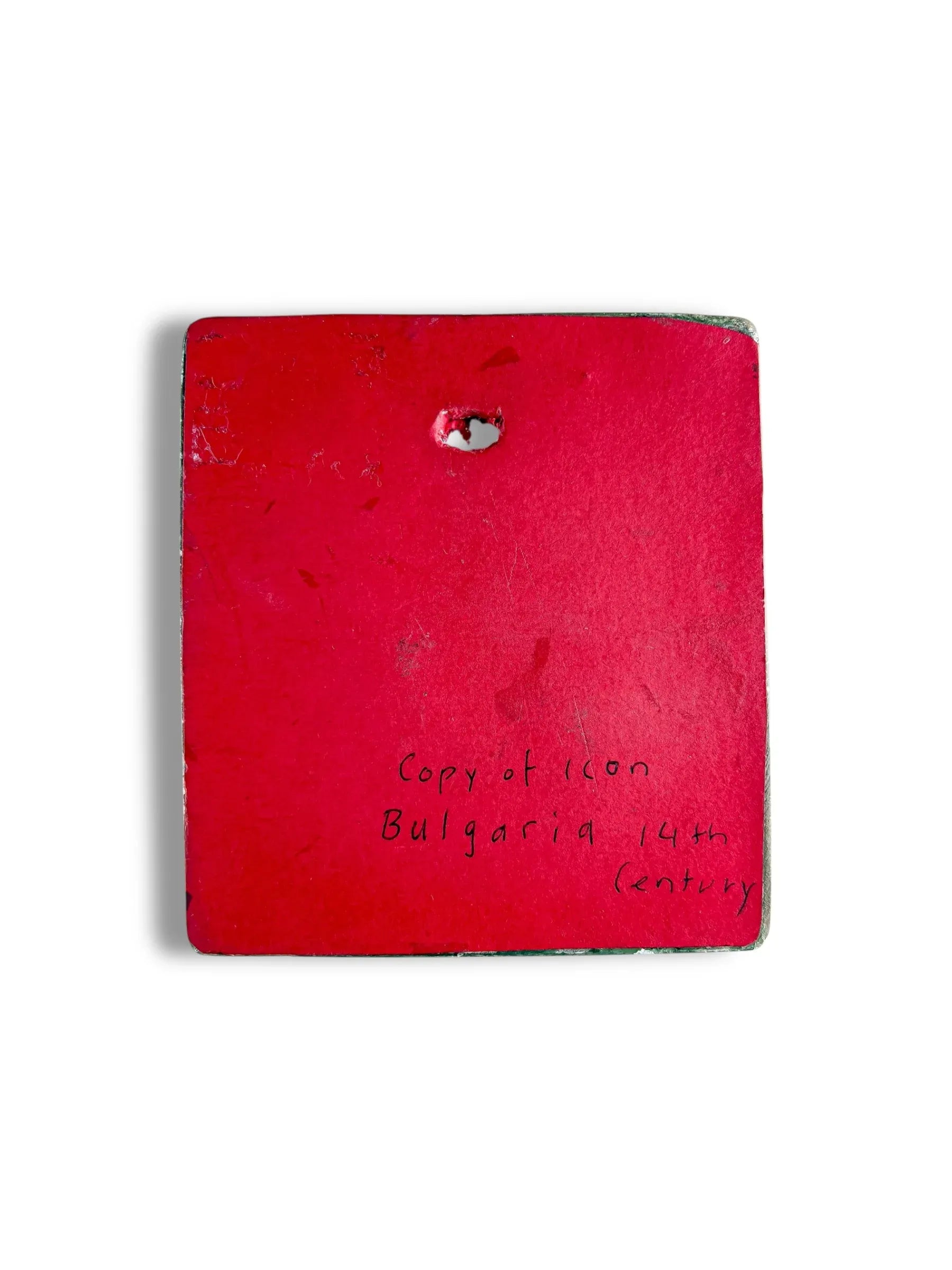 Back of a red square porcelain plaque with handwritten text 'Copy of icon Bulgaria 14th century'.