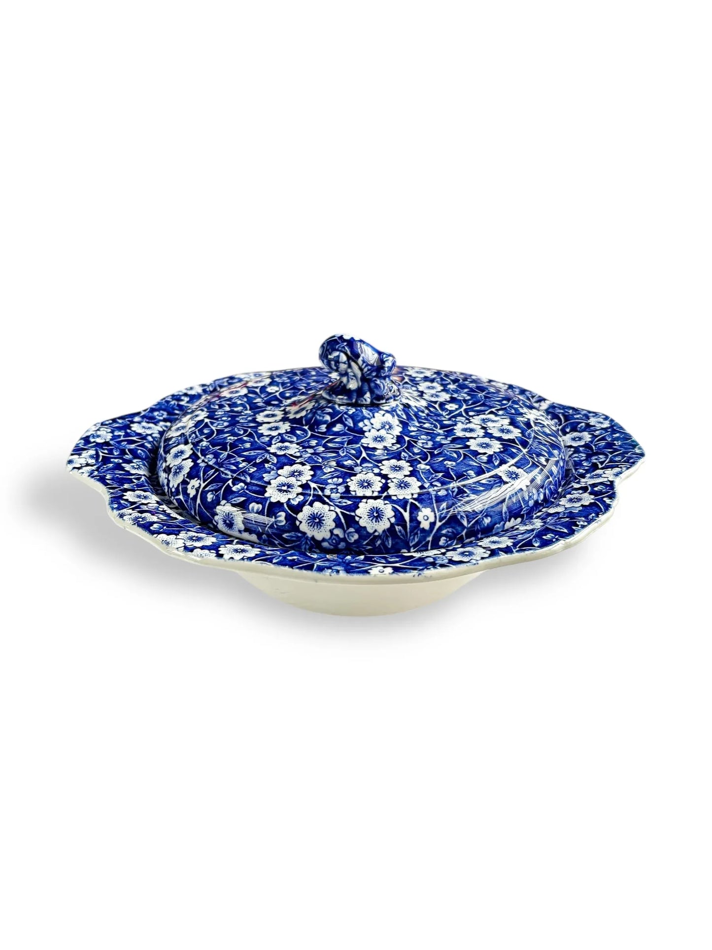 Blue and white floral patterned ceramic covered dish with scalloped edges