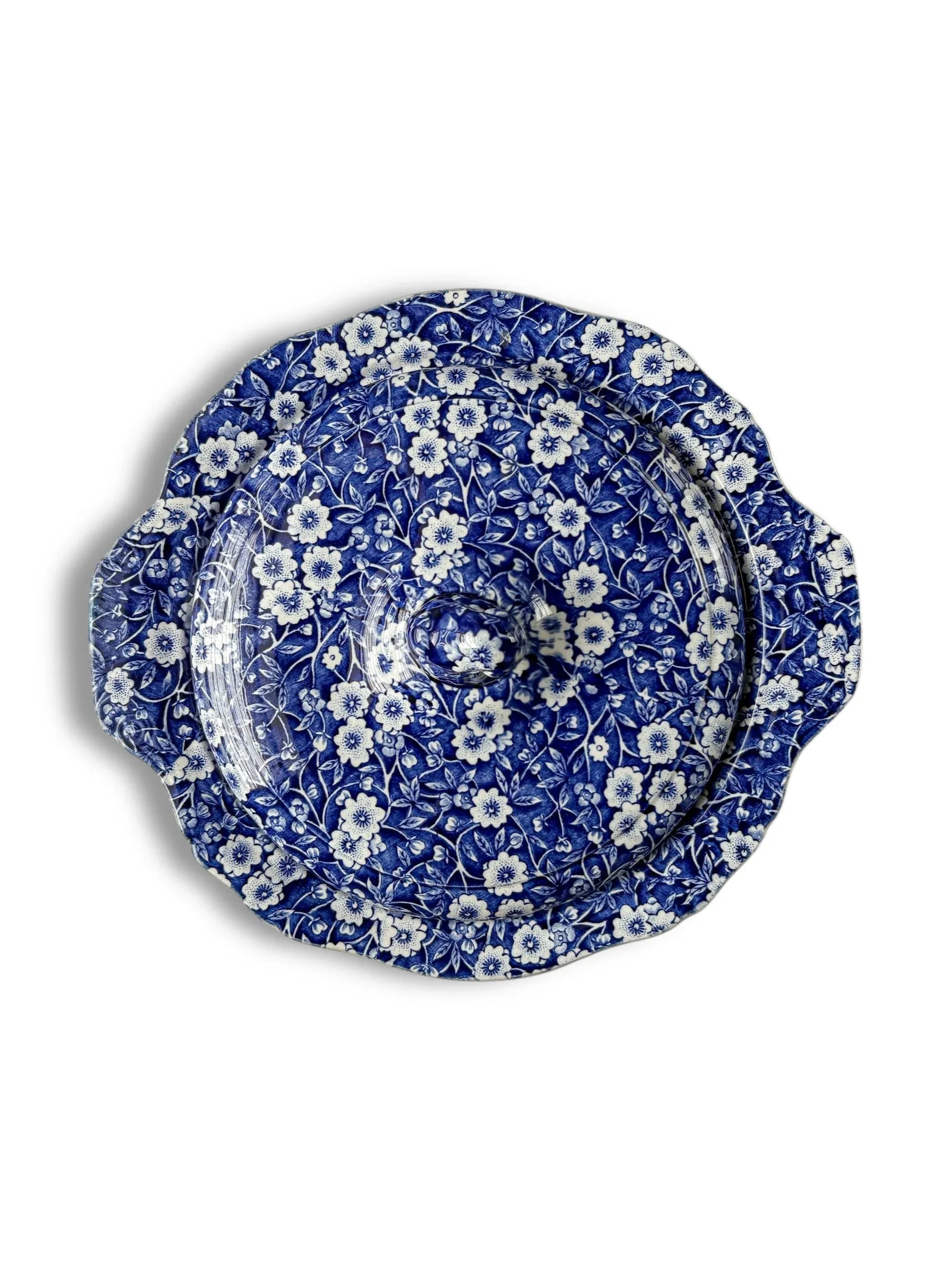 Blue and white ceramic covered dish with floral pattern and scalloped edges