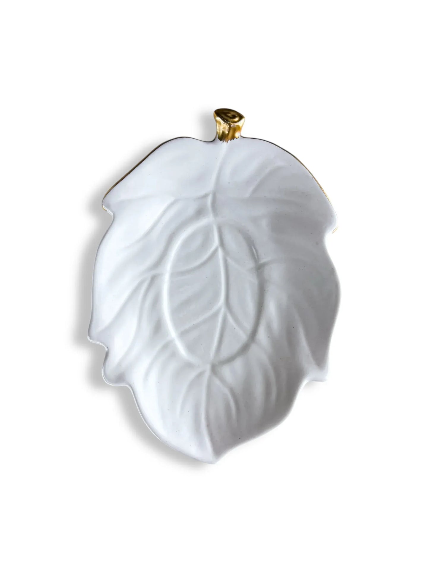 White ceramic leaf plate with gold accent on stem, elegant decorative dishware