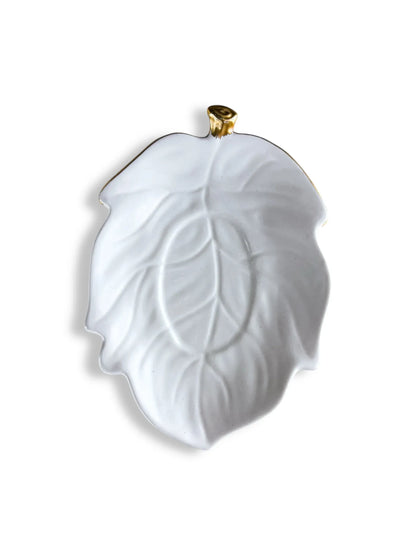 White ceramic leaf plate with gold accent on stem, elegant decorative dishware