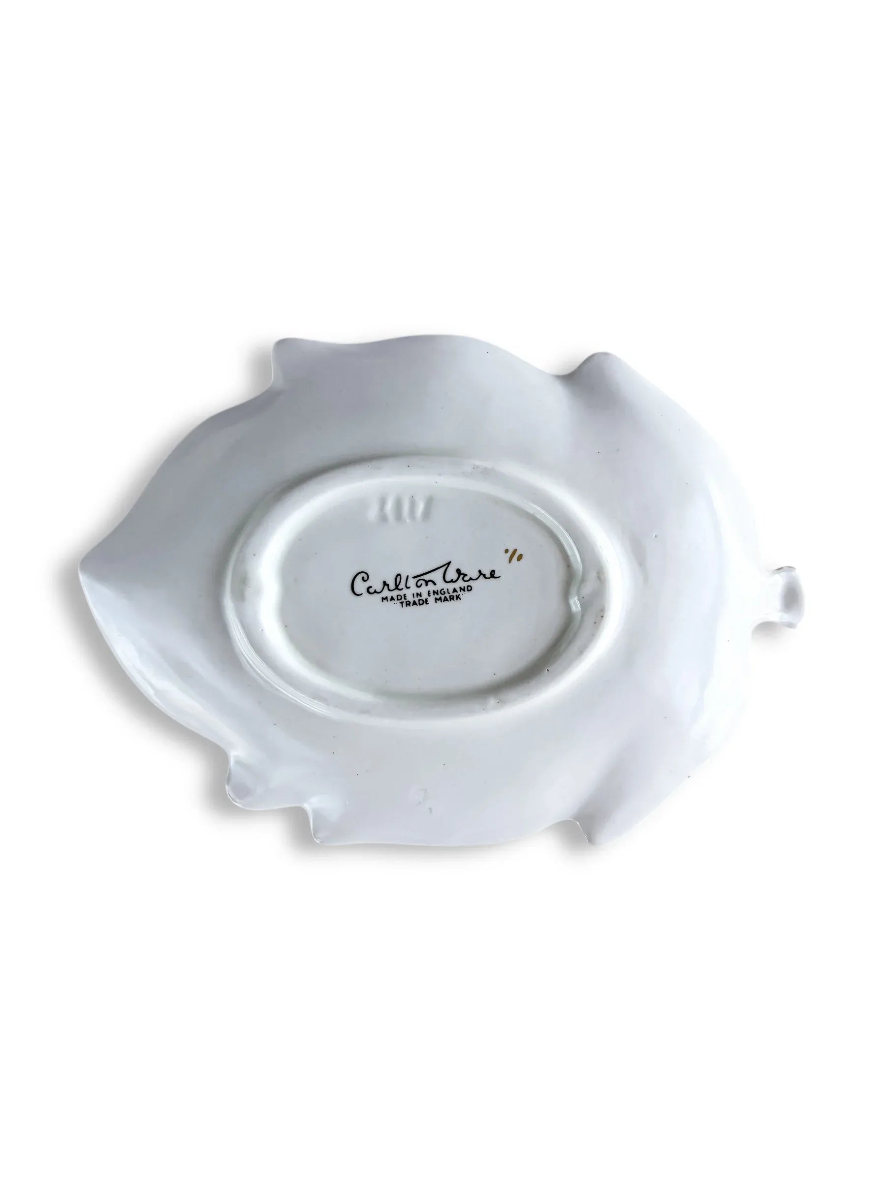 Back of white Carlton Ware ceramic dish with maker's mark on plain background