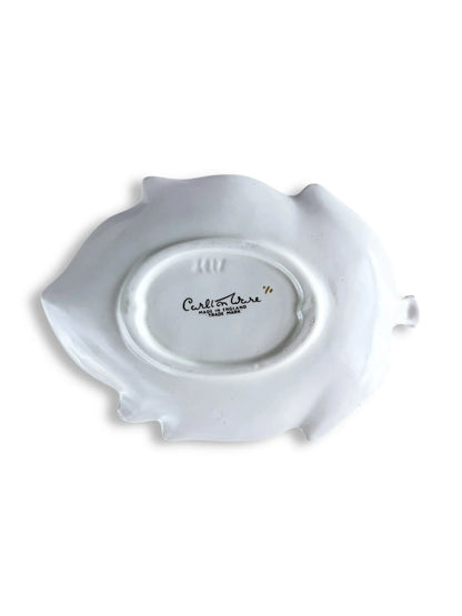 Back of white Carlton Ware ceramic dish with maker's mark on plain background