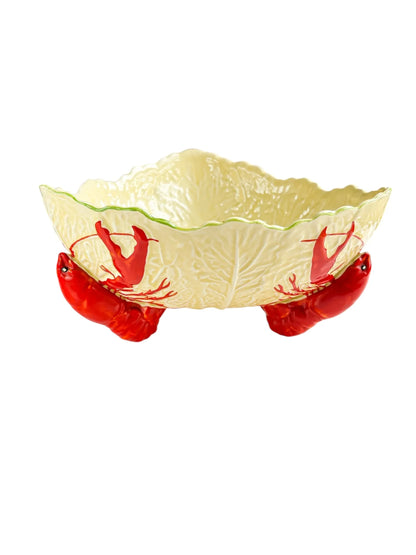 Decorative ceramic bowl shaped like lettuce leaf with three red lobster feet base